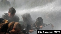 Riot police use water cannon against protesters in Hamburg during the G20 summit in Hamburg on July 7.