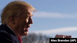 President Donald Trump speaks on the South Lawn of the White House as he walks from Marine One, January 6, 2019, in Washington