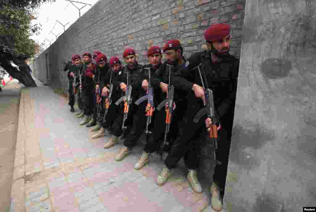 Police commandoes take cover during one such exercise at a Peshawar school.