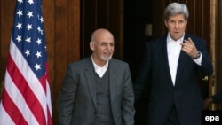 Afghan President Ashraf Ghani and US Secretary of State John Kerry addressing reporters at Camp David, Maryland