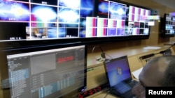 Georgia -- A technician works in the Master Control Room at First Caucasus News TV channel in Tbilisi, 24Jan2011