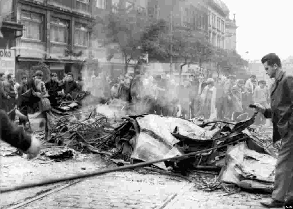 Buses and trucks used as a barricade by protesters were reduced to rubble by fire and Soviet tanks.