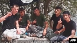 A video said to show the men who attacked foreign cyclists in Tajikistan.