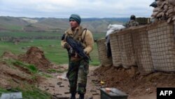 FILE: An Afghan Nation Army (ANA) soldier keeps watch during an operation in Bala Morghab district of Badghis in March 2017.