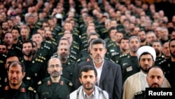 Former Iranian President Mahmoud Ahmadinejad (front row C) with commanders from the Basij Militia in Tehran May 7, 2006.