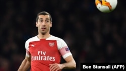 U.K. -- Arsenal's Armenian midfielder Henrikh Mkhitaryan keeps an eye on the ball during the UEFA Europa League quarter final, first leg, football match between Arsenal and Napoli at the Emirates Stadium in London, April 11, 2019