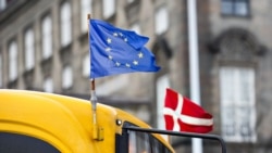 European and a Danish flags fly on a bus in Copenhagen. (File photo)