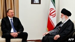 Iran's Supreme Leader Ayatollah Ali Khamenei (right) met with Azerbaijani President Ilham Aliyev in Tehran on March 5. (file photo)