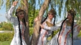 Turkmenistan -- Ashgabat. Members of one of the many national dance groups in traditional costumes