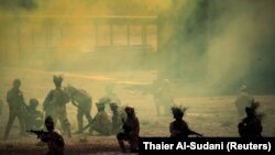 Iraqi Army's 53rd Brigade participate in a live ammunition training exercise with coalition forces trainers at Taji military base north of Baghdad, August 9, 2017