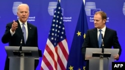 European Union President Donald Tusk (right) listens to U.S. Vice President Joe Biden at EU headquarters in Brussels on February 6.