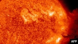 Space -- The Sun unleashing an M-2 solar flare, an S1-class radiation storm and a coronal mass ejection resulting in a large cloud of particles mushrooming up and falling back down, 07Jun2011