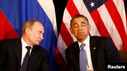 Russian President Vladimir Putin (left) and U.S. counterpart Barack Obama won't be sitting this close at the G20 summit. (file photo)