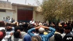 FILE: Pakistani protesters gather outside a police station during a demonstration against a Hindu man charged with blasphemy in the town of Hub in restive southwestern province of Balochistan.