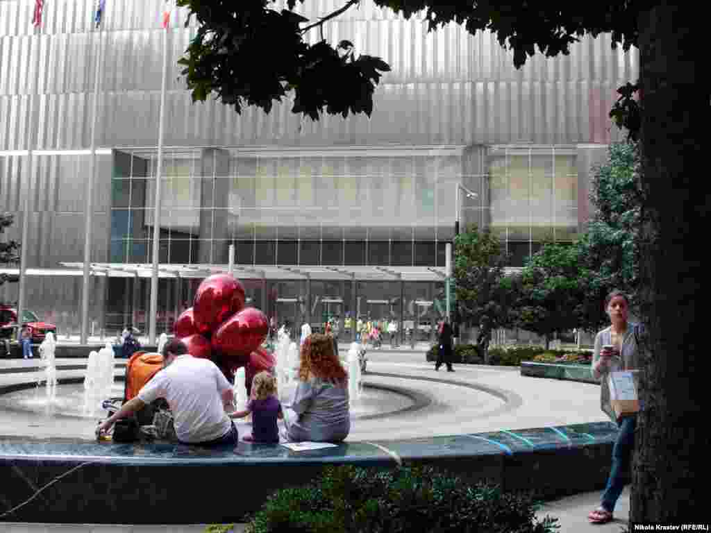 World Trade Center 7, completed in 2004, was the first new building to open. A work by sculptor Jeff Koons stands in the building's plaza.