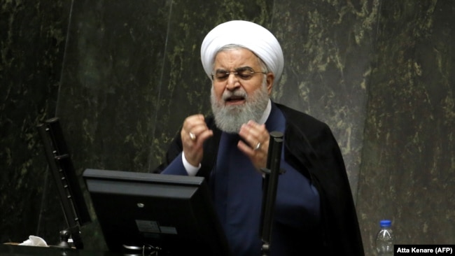 Hassan Rouhani defending his administration in the Iranian Parliament, August 28, 2018