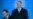 Romanian President Klaus Iohannis (right) and Prime Minister Ludovic Orban greet supporters after announcing the results of the presidential election in Bucharest on November 24. 