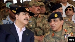 General Ashfaq Pervez Kayani (right) talks with Prime Minister Yousaf Raza Gilani during the third phase of Pakistan's biggest-ever army field exercise in April.