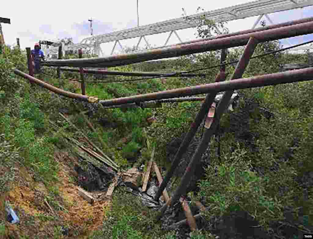 A damaged pipeline on July 13 near the site of the aviation fuel spill near the settlement of Tukhard.