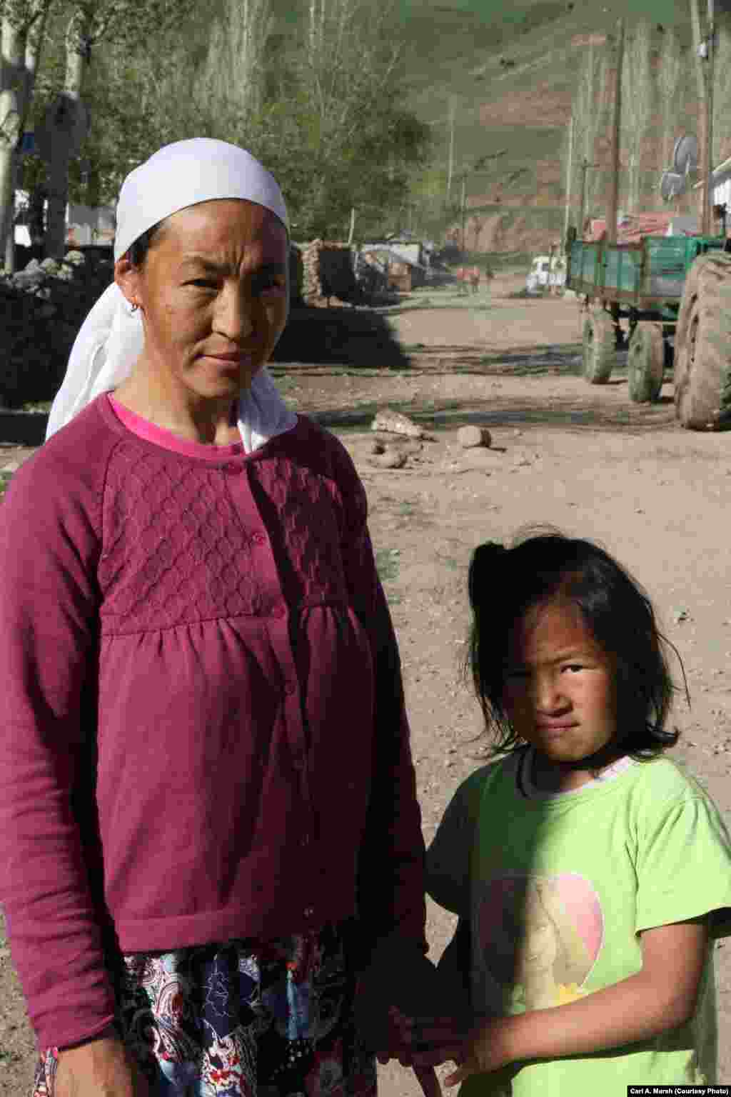 Asil and her daughter, Semanur, one of four siblings. The children have learned the Kyrgyz language, as well as Turkish. The family plans to move to Istanbul to seek better educational opportunities for the children.