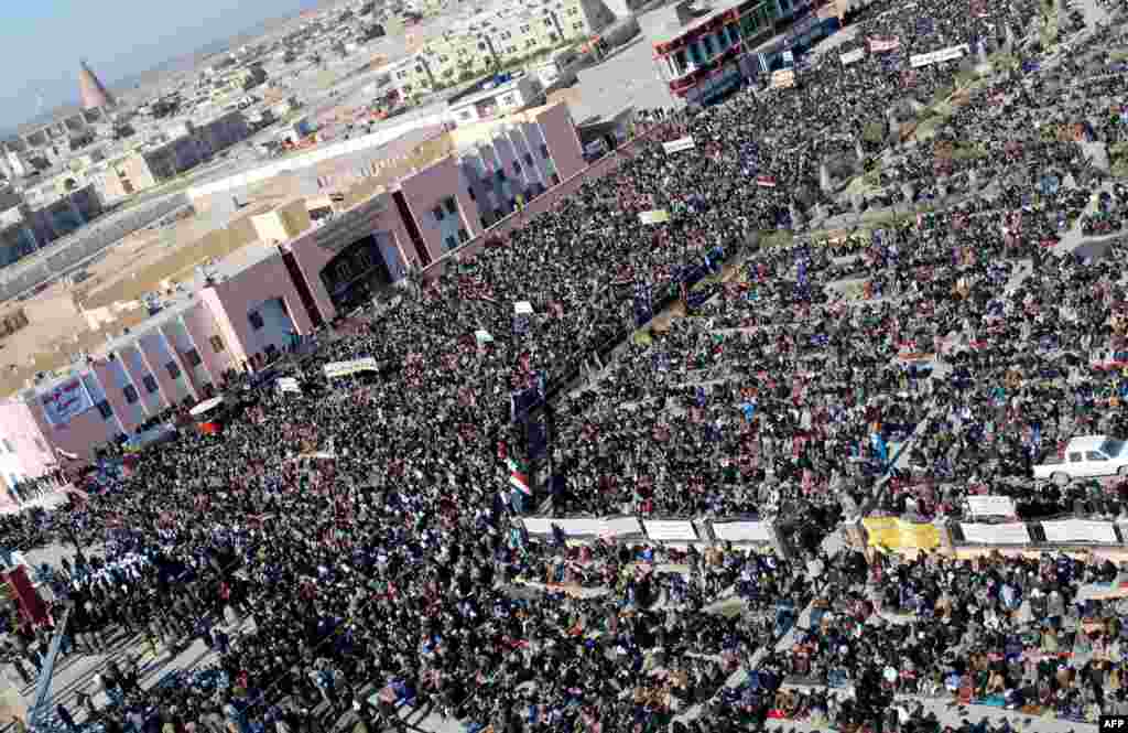 Demonstrators gather for an antigovernment protest in the central Iraqi city of Samarra. Thousands of Sunni Muslims took to the streets of Baghdad and other parts of Iraq to decry the alleged targeting of their minority, in rallies hardening opposition to the country's Shi'ite leader. (AFP)