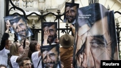 Members of the Paris-based media watchdog Reporters Without Borders protest the lack of press freedom in Iran outside Iranian Embassy in Paris in May 2010. 