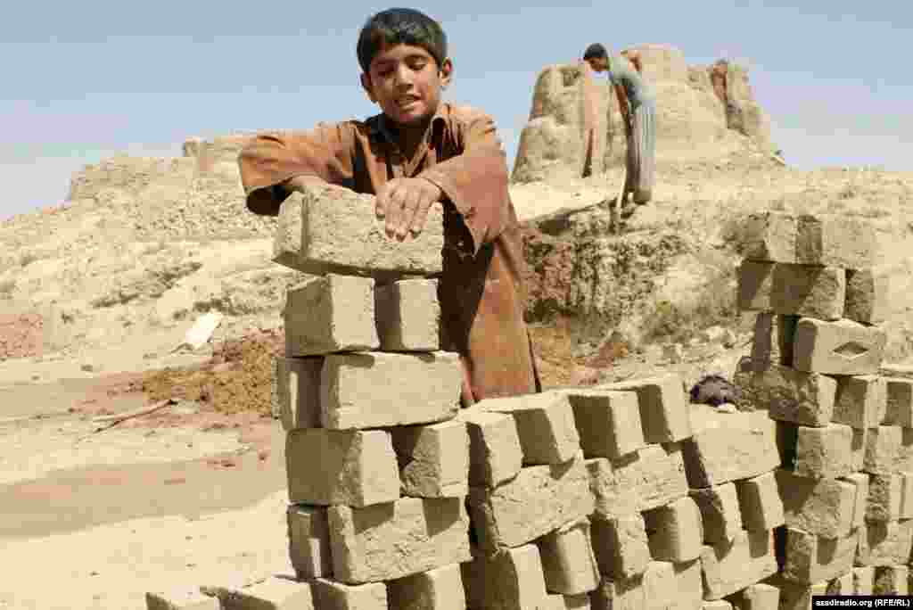 A boy working in construction. Photo by RFE/RL's Radio Free Afghanistan