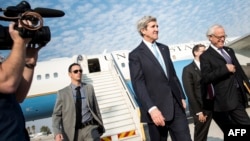 U.S. Secretary of State John Kerry (center) arrives at Tel Aviv's Ben Gurion Airport on January 2.