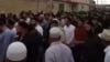 A screen grab from a video showing thousands of people gathering in the Chechen village of Geldagen for the burial of Yusup Temerkhanov on August 4. 