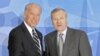U.S. Vice President Joe Biden (left) is welcomed by NATO Secretary-General Jaap de Hoop Scheffer in Brussels on March 10.