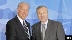 U.S. Vice President Joe Biden (left) is welcomed by NATO Secretary-General Jaap de Hoop Scheffer in Brussels on March 10.