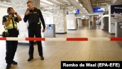 Police stand guard at the central train station in Amsterdam after the August 31 stabbing.
