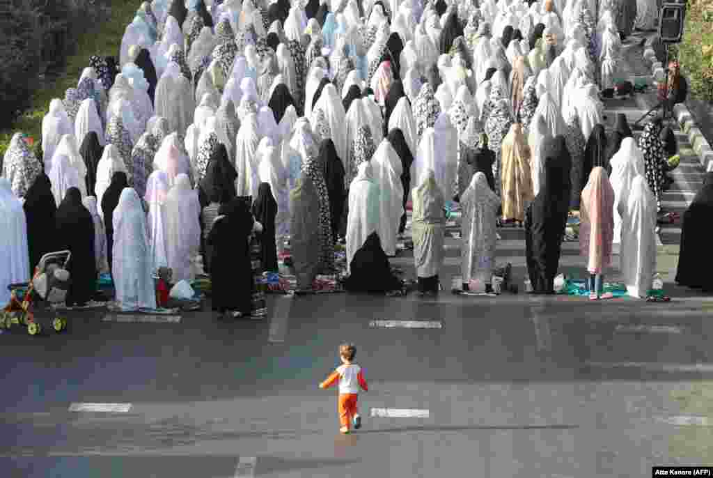 Women in the Iranian capital, Tehran, pray on the first day of Eid al-Fitr, marked by Shi'ite Muslims on August 9.