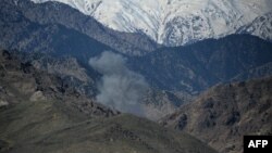 FILE: Smoke rises after an air strike on Islamic State (IS) militants positions during an operation against the group in the Achin district of Nangarhar Province in April.