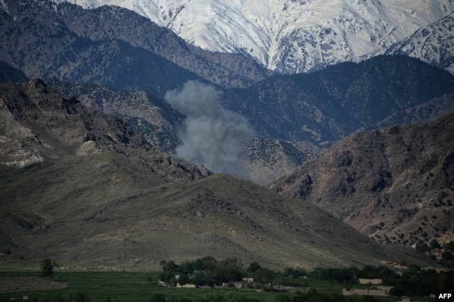 Smoke rises after an air strike on Islamic State (IS) militants in an operation in the Achin district of Nangarhar Province on April 14, one day after the dropping of the MOAB bomb in the same area.