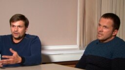 Anatoly Chepiga, aka Ruslan Boshirov (left), and Aleksandr Mishkin, aka Aleksandr Petrov, speak to RT in Moscow on September 13.