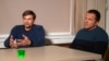 Men identifying themselves as Ruslan Boshirov (left) and Aleksandr Petrov -- now believed to be GRU officers Anatoly Chepiga (left) and Aleksandr Mishkin -- speak to the Kremlin-funded RT channel in Moscow on September 13.