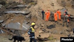 Armenia - Rescue teams work at the site of a powerful landslide, 3Oct2011.