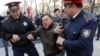 KAZAKHSTAN -- Police officers detain an anti-government protester during a rally in Almaty, Kazakhstan March 22, 2019. 