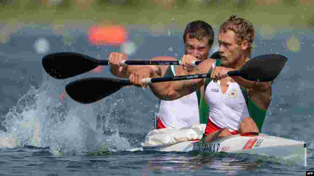 Belarus's Raman Piatrushenka (right) and Vadzim Makhneu compete in the kayak double 200-meter men's heats during the London Olympics. (AFP/Damien Meyer)