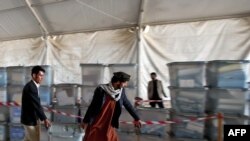 Afghan election workers move ballot boxes to the Independent Election Commission (IEC) warehouse in Kabul on September 19 in preparation for counting.