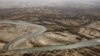 An aerial view shows the Helmand River in Afghanistan's Helmand Province. According to a 1973 agreement, Afghanistan is obligated to provide Iran with 850 million cubic meters of water annually from the Helmand River. 