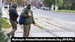 NABU agents are seen outside the mayor's residence on October 23.