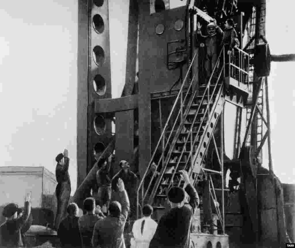 Gagarin waves before the launch of the Vostok 1 from the Baikonur Cosmodrome in the Soviet republic of Kazakhstan.