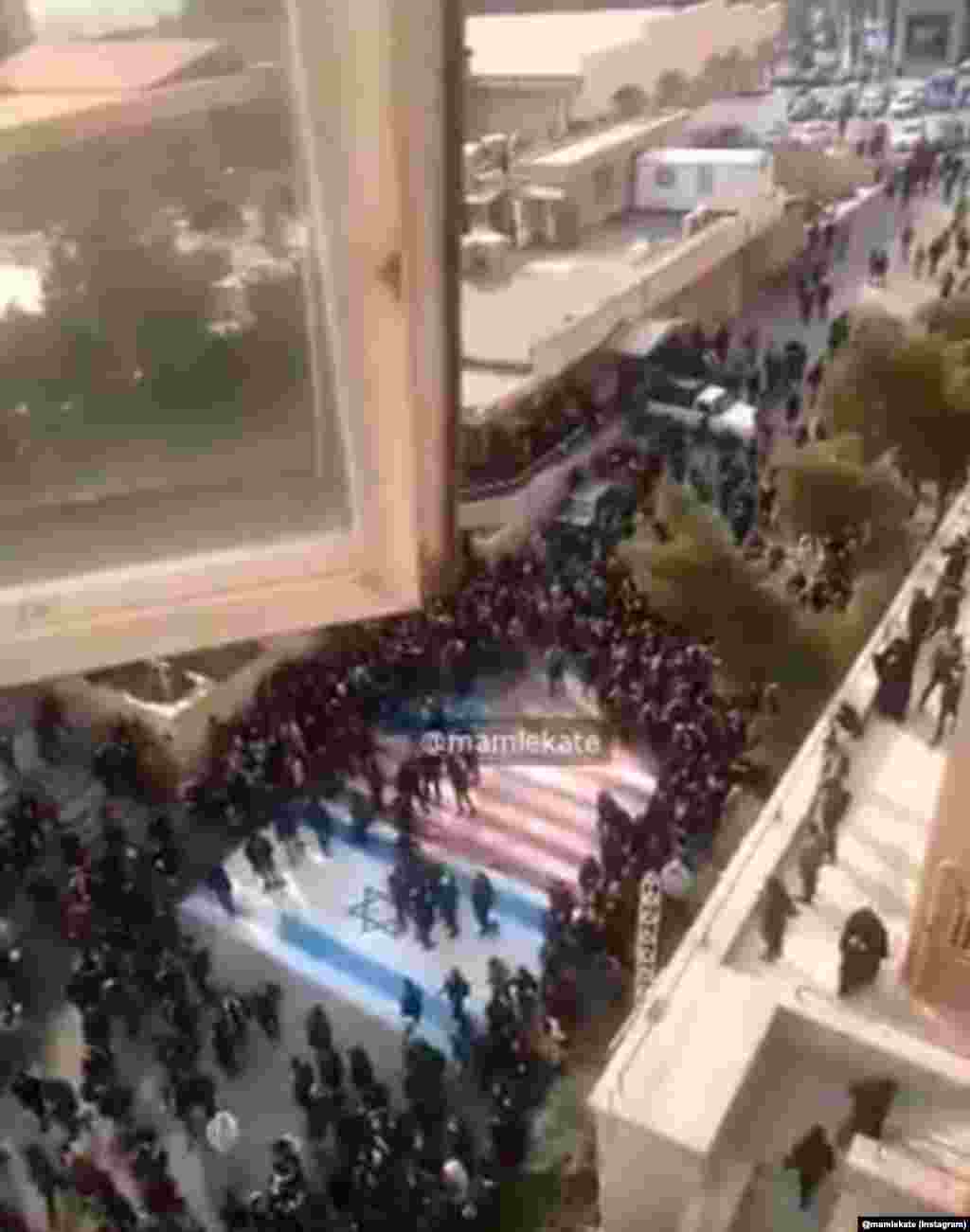Protesters avoided stepping on the U.S. and Israeli flags while gathering at Beheshti University campus on January 12. Just nine days earlier, other angry crowds were seen burning those flags after Iranian military commander Qasem Soleimani was assassinated by a U.S. drone strike in Iraq. 