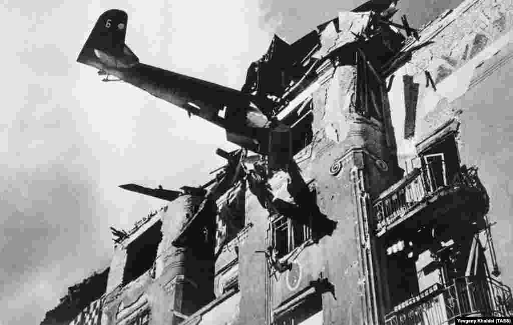 A Nazi plane that had slammed into an apartment block in Budapest, photographed in 1945.