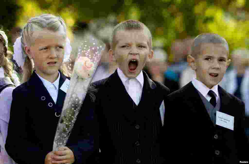 In Belarus, first-grade pupils attend a festive line-up to mark the start of another school year in Slutsk. (Reuters/Vasily Fedosenko)