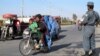 Afghan security officials check people at a road side as part of increased security measures in Helmand Province following the death of Islamic State recruiter Mullah Abdul Rauf in a military operation on February 9. 