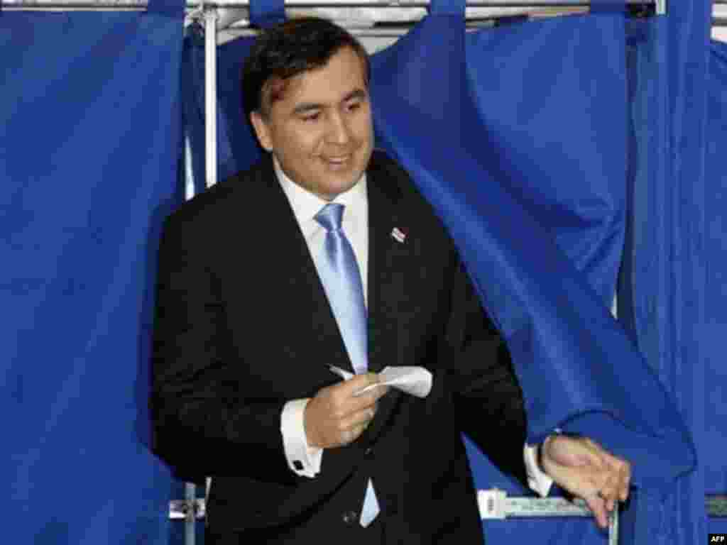 Incumbent President Mikheil Saakashvili, seen here exiting a polling booth in Tbilisi, is the favorite to win. The election is seen as a referendum on Saakashvili and the 2003 Rose Revolution.