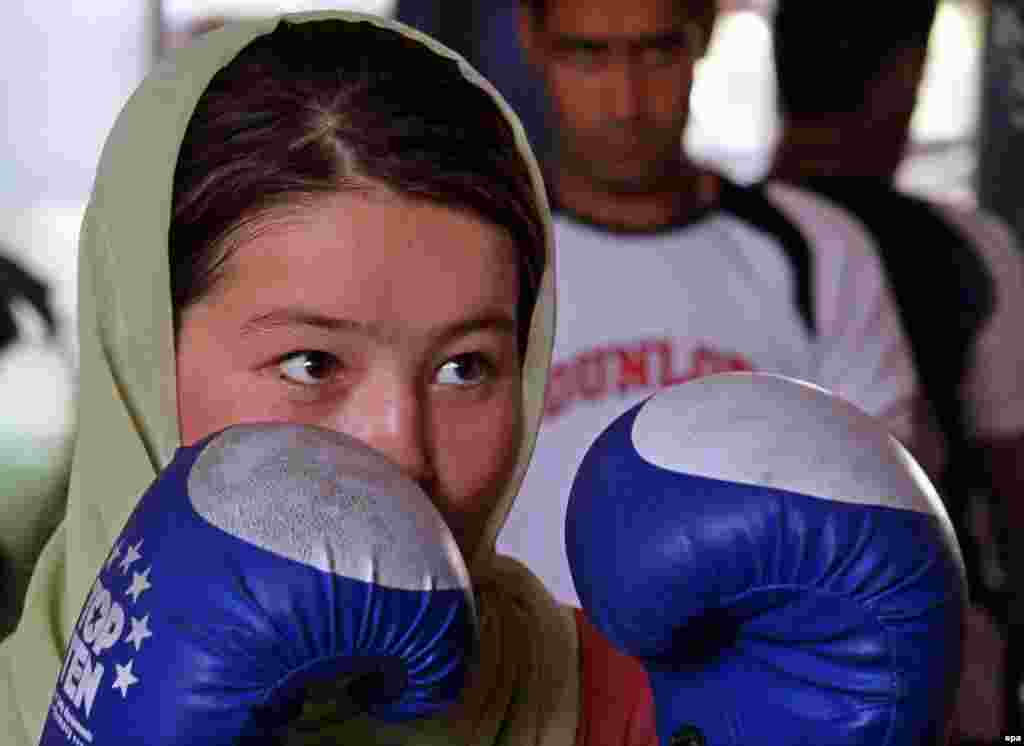 Afghanistan -- A female boxer akes part in a practice session in preparation for the London 2012 Olympics at a gym in Kabul, 09Aug2011